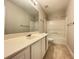 Bathroom with double vanity, updated lighting, and bathtub with shower at 690 Kimball Parc Way, Alpharetta, GA 30022