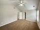 Large bedroom with neutral walls, plush carpeting, and access to closet and ensuite at 690 Kimball Parc Way, Alpharetta, GA 30022