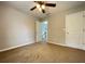 Bedroom features neutral walls, carpeted floor, and closet at 690 Kimball Parc Way, Alpharetta, GA 30022