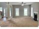 Bright and airy living room with a fireplace, ceiling fan, and neutral color palette at 690 Kimball Parc Way, Alpharetta, GA 30022