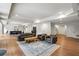 Finished basement featuring a comfortable seating area, modern lighting, and convenient access to a kitchenette and staircase at 1430 N Harris Rdg, Atlanta, GA 30327