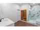 Modern bathroom showcasing a marble shower, sleek fixtures, a wood sauna and a white vanity for a spa-like experience at 1430 N Harris Rdg, Atlanta, GA 30327