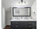 Bathroom featuring double vanity, black fixtures, and a minimalist design at 1430 N Harris Rdg, Atlanta, GA 30327
