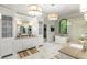 Bright bathroom with double vanity, tub and marble floors, enhanced by natural light at 1430 N Harris Rdg, Atlanta, GA 30327