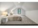 Bright bedroom featuring a window, sloped ceilings and carpet flooring at 1430 N Harris Rdg, Atlanta, GA 30327