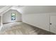 Bedroom with carpet, sloped ceilings, and natural light from a window at 1430 N Harris Rdg, Atlanta, GA 30327