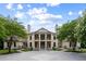 Stunning two-story home boasting a symmetrical facade, manicured landscaping, and an inviting driveway at 1430 N Harris Rdg, Atlanta, GA 30327
