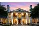 Beautiful two-story home with a stately entrance, manicured lawn, and balanced design at 1430 N Harris Rdg, Atlanta, GA 30327