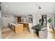 Bright, open-concept kitchen boasts double islands with stone countertops and an adjacent breakfast area with comfortable seating at 1430 N Harris Rdg, Atlanta, GA 30327