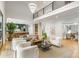 Bright, open-concept living room seamlessly connecting to the modern kitchen, with soaring ceilings at 1430 N Harris Rdg, Atlanta, GA 30327