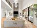 Bright living room boasting soaring ceilings, a stone fireplace, and access to an outdoor deck at 1430 N Harris Rdg, Atlanta, GA 30327
