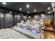 Home theater room featuring reclining seats, custom lighting, a projector screen, and built-in storage and snack bar at 1430 N Harris Rdg, Atlanta, GA 30327