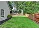 Well-maintained backyard with lush green grass and a charming fence; perfect for outdoor enjoyment and privacy at 2633 Hanriva Ct, Dacula, GA 30019