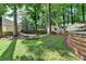 Spacious backyard with a hammock, offering a serene outdoor living space with mature trees at 2633 Hanriva Ct, Dacula, GA 30019