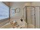 Inviting bathroom featuring a soaking tub, glass shower, and modern decor at 2633 Hanriva Ct, Dacula, GA 30019