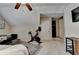 Comfortable bedroom features a ceiling fan, peloton, and an adjacent sitting area at 2633 Hanriva Ct, Dacula, GA 30019
