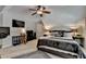 Bedroom features sloped ceilings, ceiling fan, and modern decor at 2633 Hanriva Ct, Dacula, GA 30019