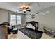 Bedroom with a ceiling fan, airplane-themed wall art, and a window with natural light at 2633 Hanriva Ct, Dacula, GA 30019