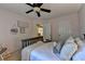 Well decorated bedroom with decorative pillows, rocking chair, and natural light at 2633 Hanriva Ct, Dacula, GA 30019