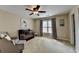 Spacious room with crib, chair, ottoman, and soft carpet at 2633 Hanriva Ct, Dacula, GA 30019