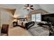 Cozy bedroom with sloped ceilings, a ceiling fan, and a modern rug at 2633 Hanriva Ct, Dacula, GA 30019