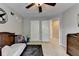 Bedroom with a ceiling fan, airplane-themed wall art, and a window with natural light at 2633 Hanriva Ct, Dacula, GA 30019