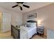 Bright bedroom features a comfortable bed and a gray nightstand with storage basket at 2633 Hanriva Ct, Dacula, GA 30019