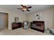 Neutral bedroom with crib, chair, ottoman, dresser, and soft carpet at 2633 Hanriva Ct, Dacula, GA 30019