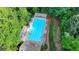 Aerial view of a sparkling community pool, surrounded by lush greenery, inviting residents for refreshing swims at 2633 Hanriva Ct, Dacula, GA 30019