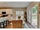 Bright dining area features backyard access, a modern rug, and seating for four at 2633 Hanriva Ct, Dacula, GA 30019