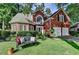 Charming brick home featuring a landscaped front yard, two-car garage, and an inviting front bench at 2633 Hanriva Ct, Dacula, GA 30019