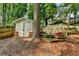 Outdoor shed with a double door, providing ample storage in the backyard at 2633 Hanriva Ct, Dacula, GA 30019