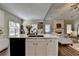 Well-appointed kitchen island overlooking living area and access to patio at 2633 Hanriva Ct, Dacula, GA 30019
