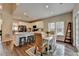 Charming eat-in kitchen features white cabinets, an island with barstool seating, and lots of natural light at 2633 Hanriva Ct, Dacula, GA 30019