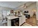Open-concept kitchen with an island and seamless flow to an adjacent living space at 2633 Hanriva Ct, Dacula, GA 30019
