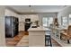 Modern kitchen with a large island, stainless steel appliances, and breakfast nook with doors to patio at 2633 Hanriva Ct, Dacula, GA 30019