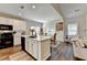 Open layout kitchen with a center island that overlooks the adjacent living space at 2633 Hanriva Ct, Dacula, GA 30019