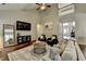 Bright living room with soaring ceilings, hardwood floors, neutral colors, and lots of comfortable seating at 2633 Hanriva Ct, Dacula, GA 30019