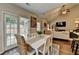 Dining area with a view of the backyard, with backyard access and open concept to the Gathering room at 2633 Hanriva Ct, Dacula, GA 30019