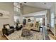 Open concept living room and kitchen with hardwood floors, neutral decor, and plenty of sunlight at 2633 Hanriva Ct, Dacula, GA 30019