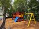 Community playground offers a colorful play structure with swings and climbing features at 2633 Hanriva Ct, Dacula, GA 30019