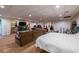 Finished basement with large sectional sofa, carpet, and a bedroom area at 305 Saddle Wood Dr, Canton, GA 30114