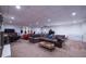 Finished basement with sofa, TV, desk, and an adjacent bedroom area at 305 Saddle Wood Dr, Canton, GA 30114