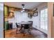 Cozy dining area with a round table, modern chairs, and laminate flooring at 305 Saddle Wood Dr, Canton, GA 30114