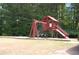 Community playground featuring wooden structure with slides and swingset at 305 Saddle Wood Dr, Canton, GA 30114