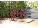Community playground with a wooden structure, slides, and a picnic table at 305 Saddle Wood Dr, Canton, GA 30114