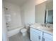 Bright bathroom featuring white subway tile surround, a shower-tub combination, and vanity with countertop basin at 532 Healy Dr # 61, Cumming, GA 30040