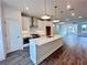 Modern kitchen features a large island, stainless steel appliances, and ample cabinet space at 532 Healy Dr # 61, Cumming, GA 30040