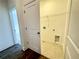 Bright laundry room with tile flooring, utility sink, and wire shelving for efficient storage at 532 Healy Dr # 61, Cumming, GA 30040