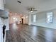 Open-concept living room flows into the kitchen, boasting hardwood floors and natural light at 532 Healy Dr # 61, Cumming, GA 30040